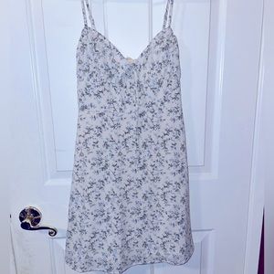 Selling a floral summer dress from store Her Closet